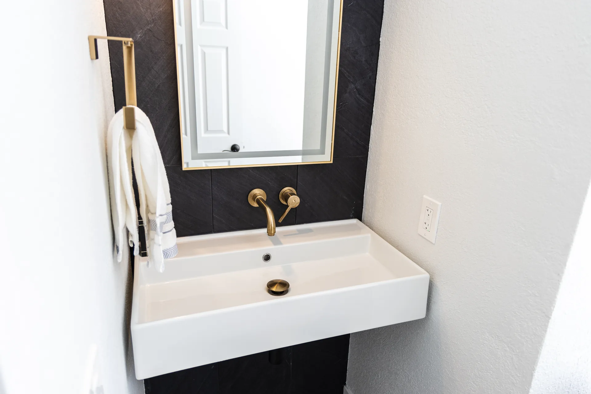 Whole-home remodel — vanity with brass fixtures, Orange, Avorino
