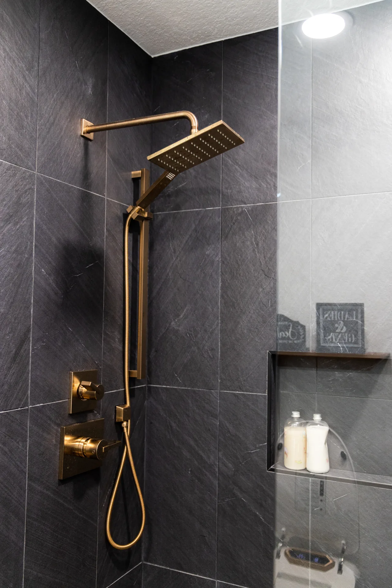 Whole-home remodel — shower with brass rain head, Orange, Avorino