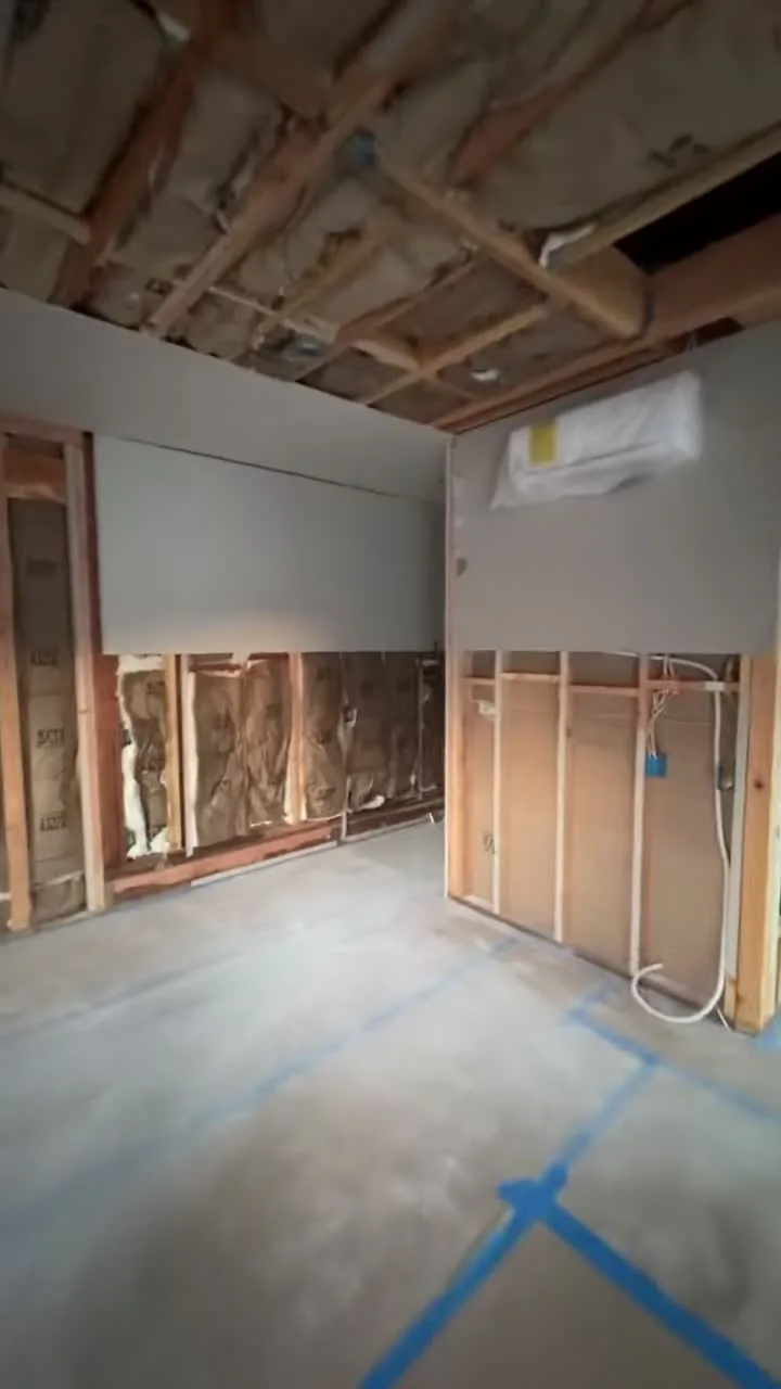 Garage conversion ADU under construction — insulation in and the first drywall sheets up, Brea, Avorino