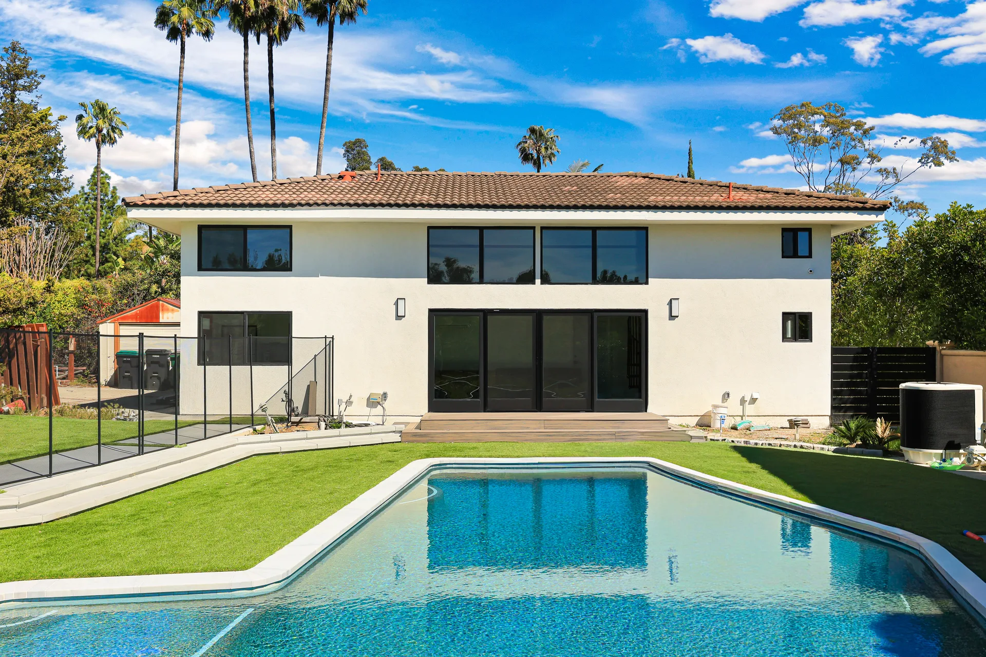 Avorino custom home in Santa Ana — pool & rear elevation