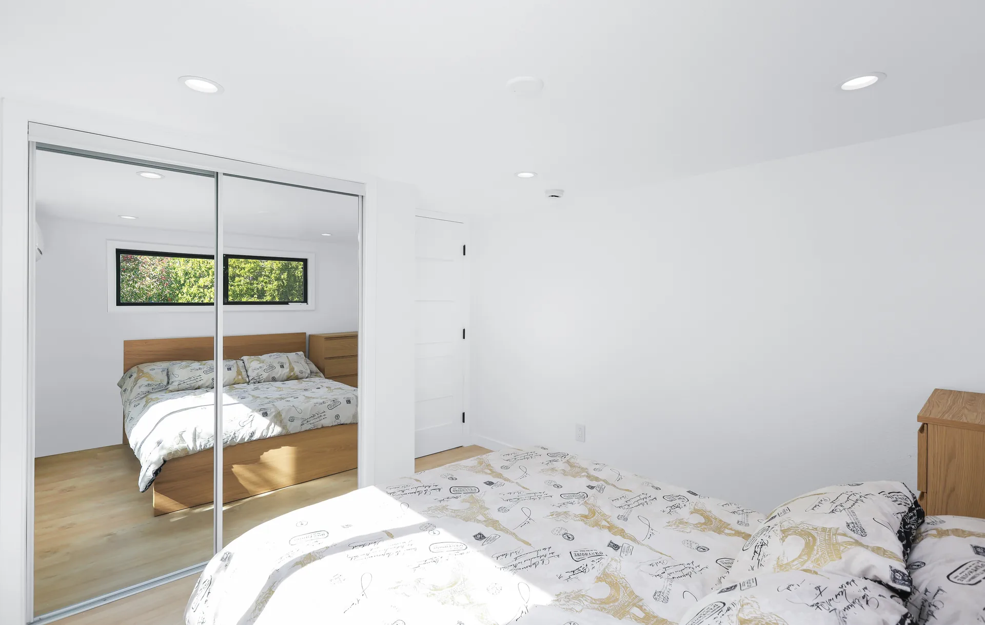 Two-story detached ADU — bedroom with mirrored closet, Santa Ana Hills, Avorino