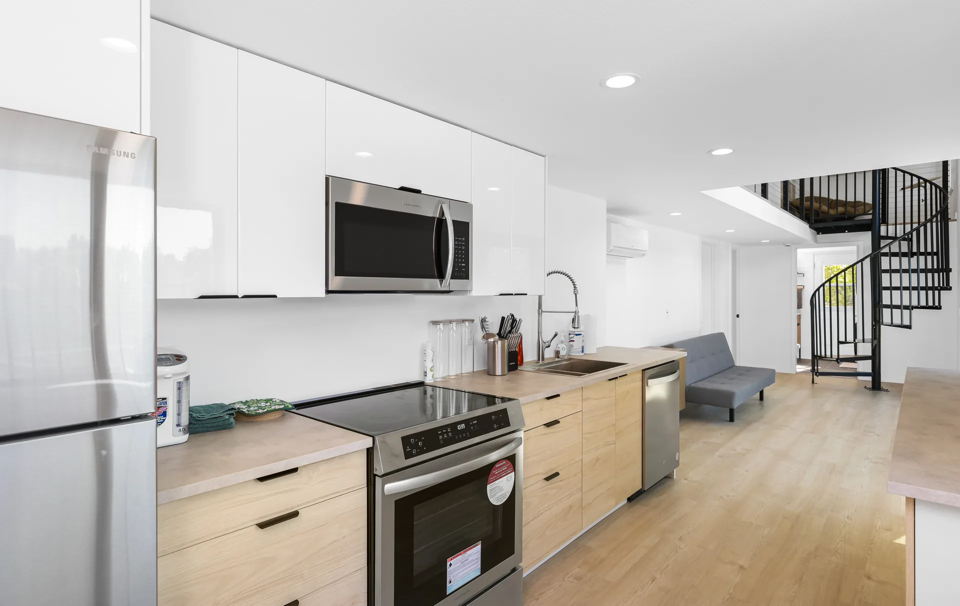 Two-story detached ADU — kitchen with white uppers and light-oak lowers, Santa Ana Hills, Avorino