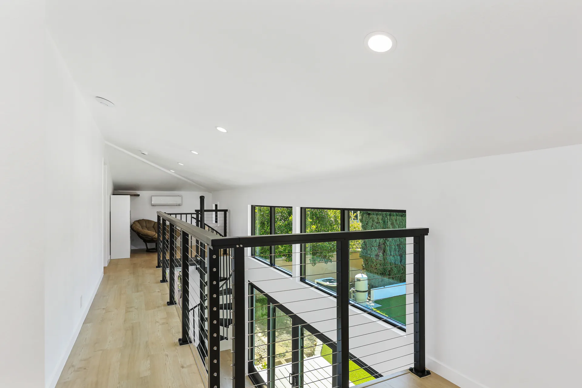 Two-story detached ADU — loft looking down to the sliders, Santa Ana Hills, Avorino