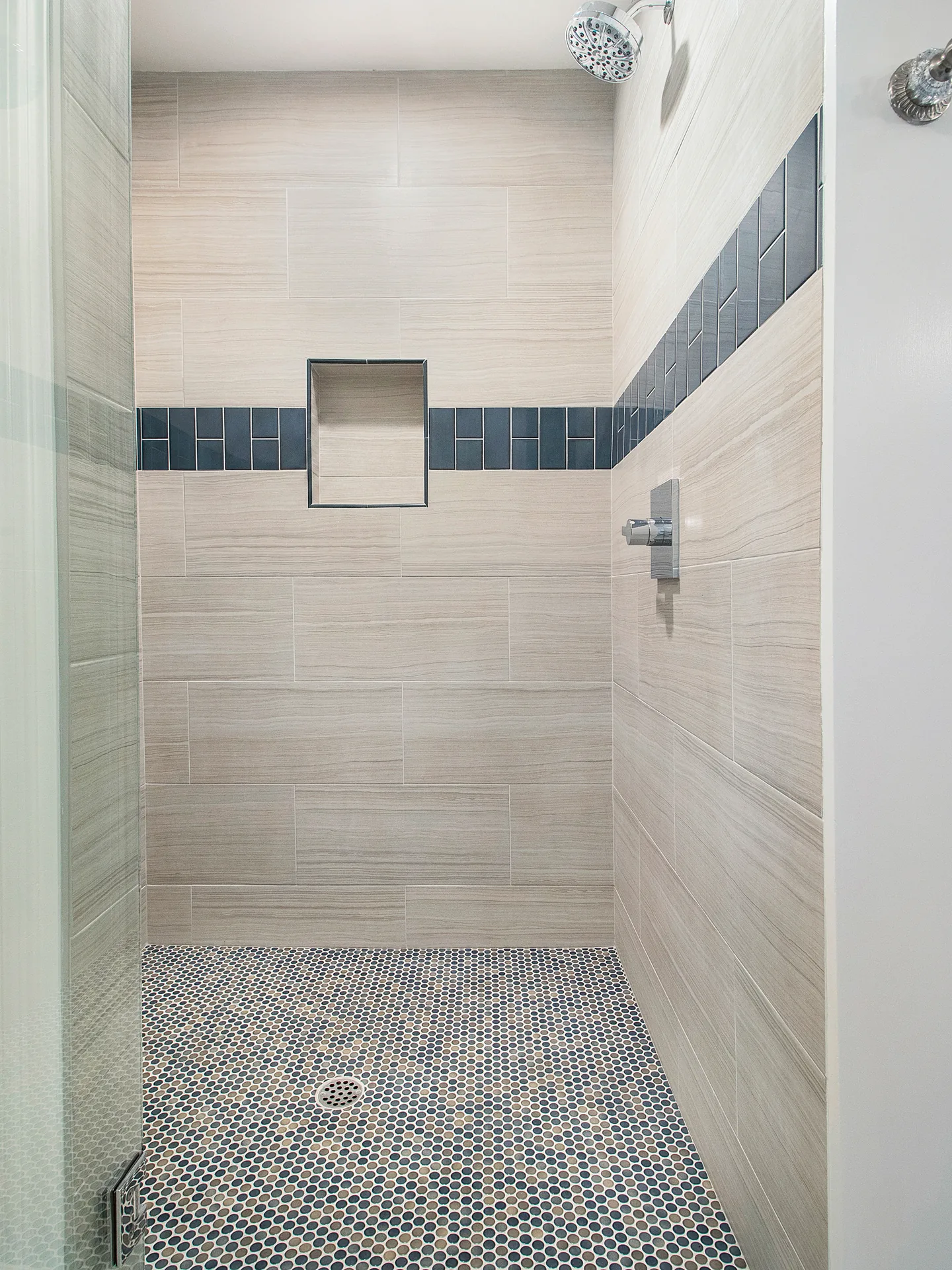 Primary bath remodel — walk-in shower with navy tile band, Mission Viejo, Avorino