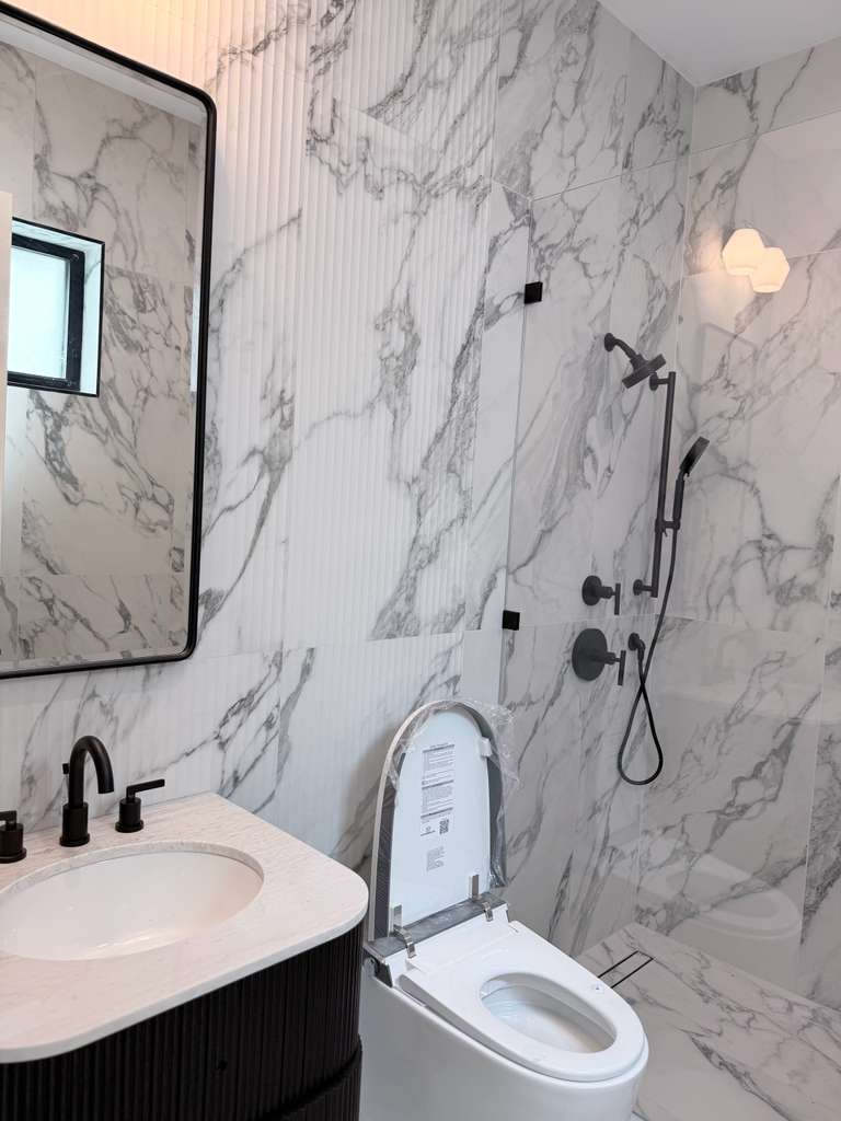 Primary bath wrapped in marble
