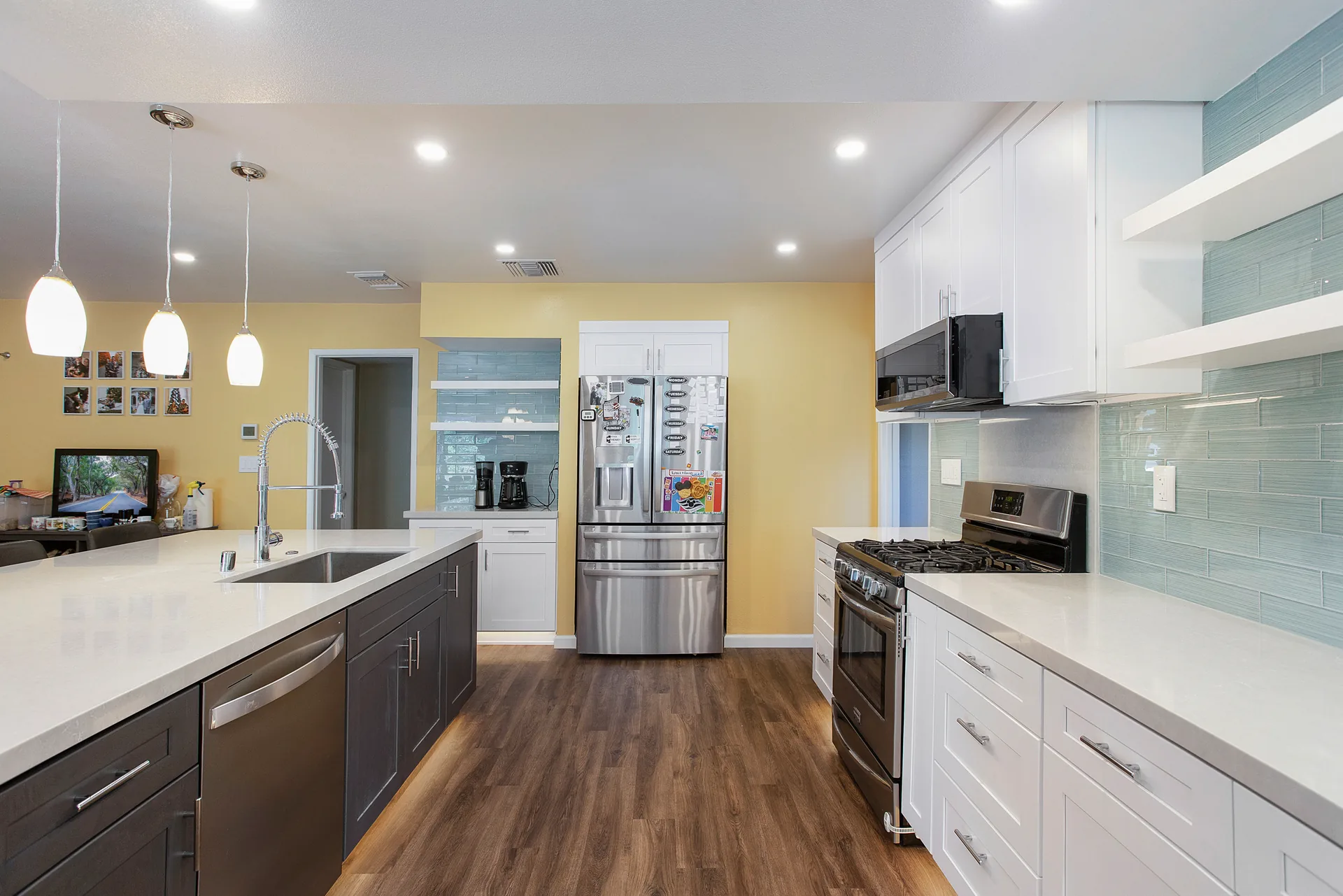Open-concept kitchen remodel — glass-tile backsplash and range wall, Orange, Avorino