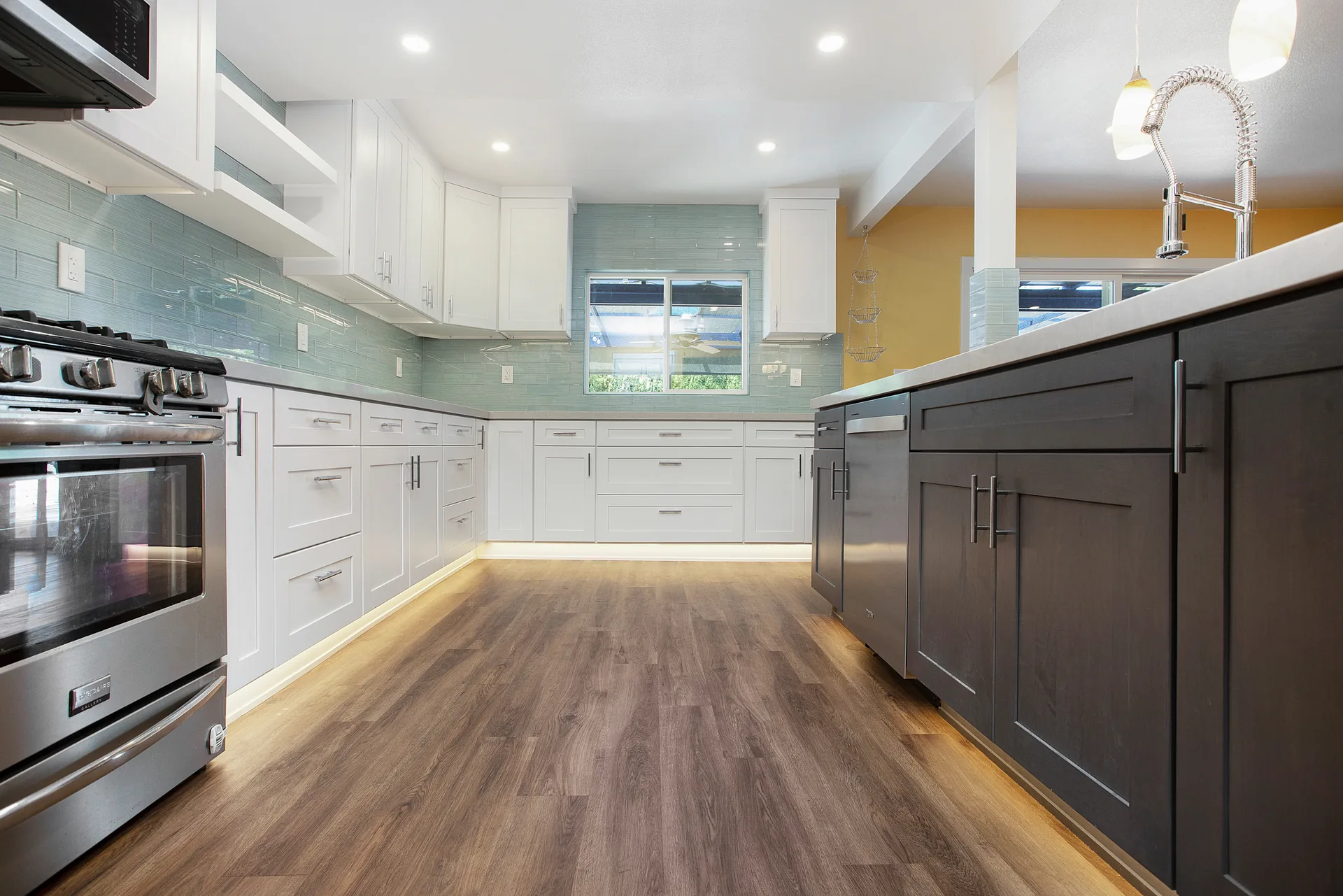 Open-concept kitchen remodel — dark island with waterfall edge, Orange, Avorino