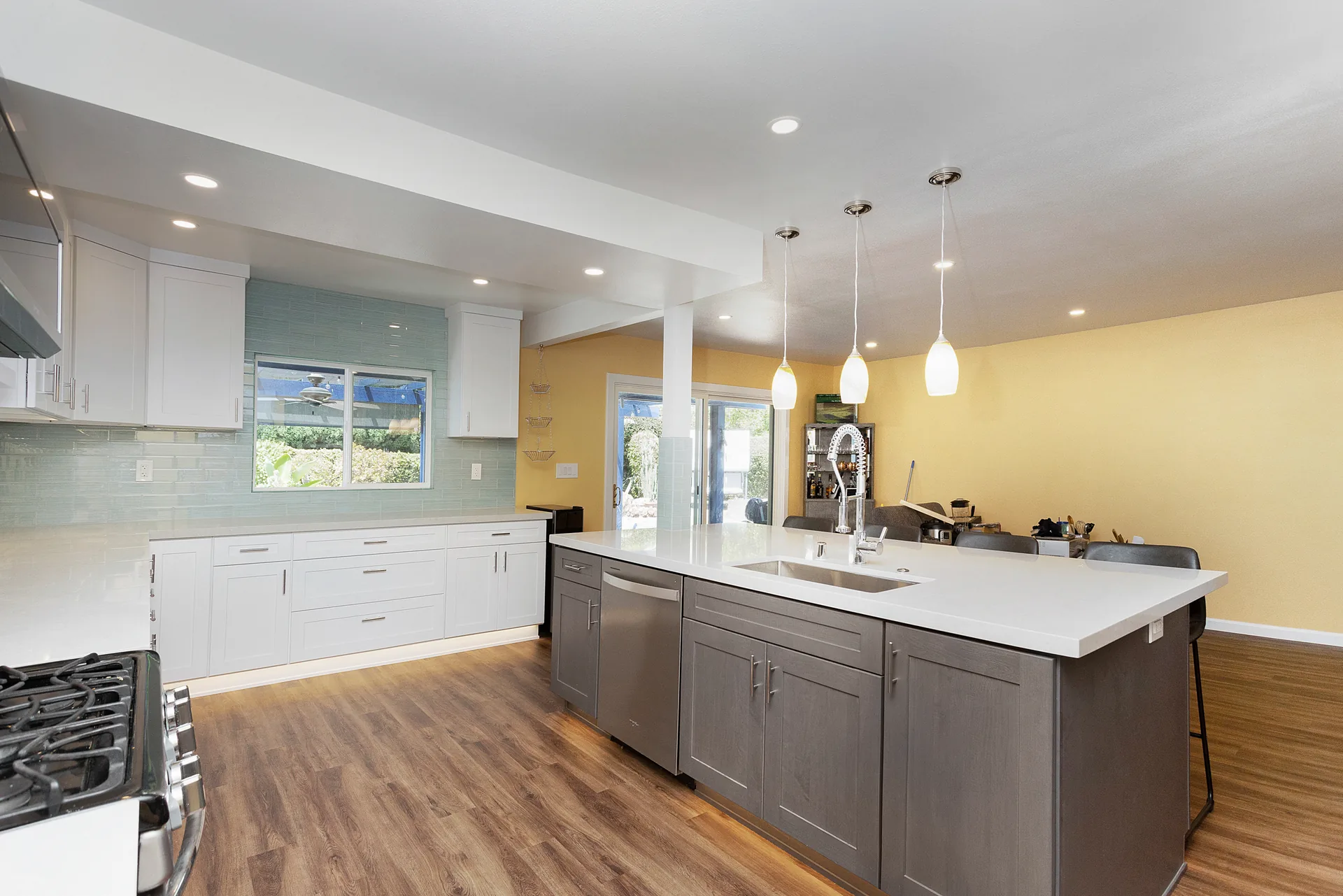 Open-concept kitchen remodel — island toward the window, Orange, Avorino