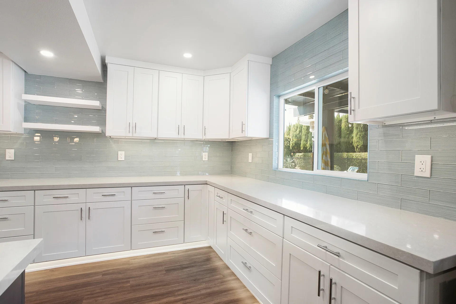 Open-concept kitchen remodel — counter run under the window, Orange, Avorino