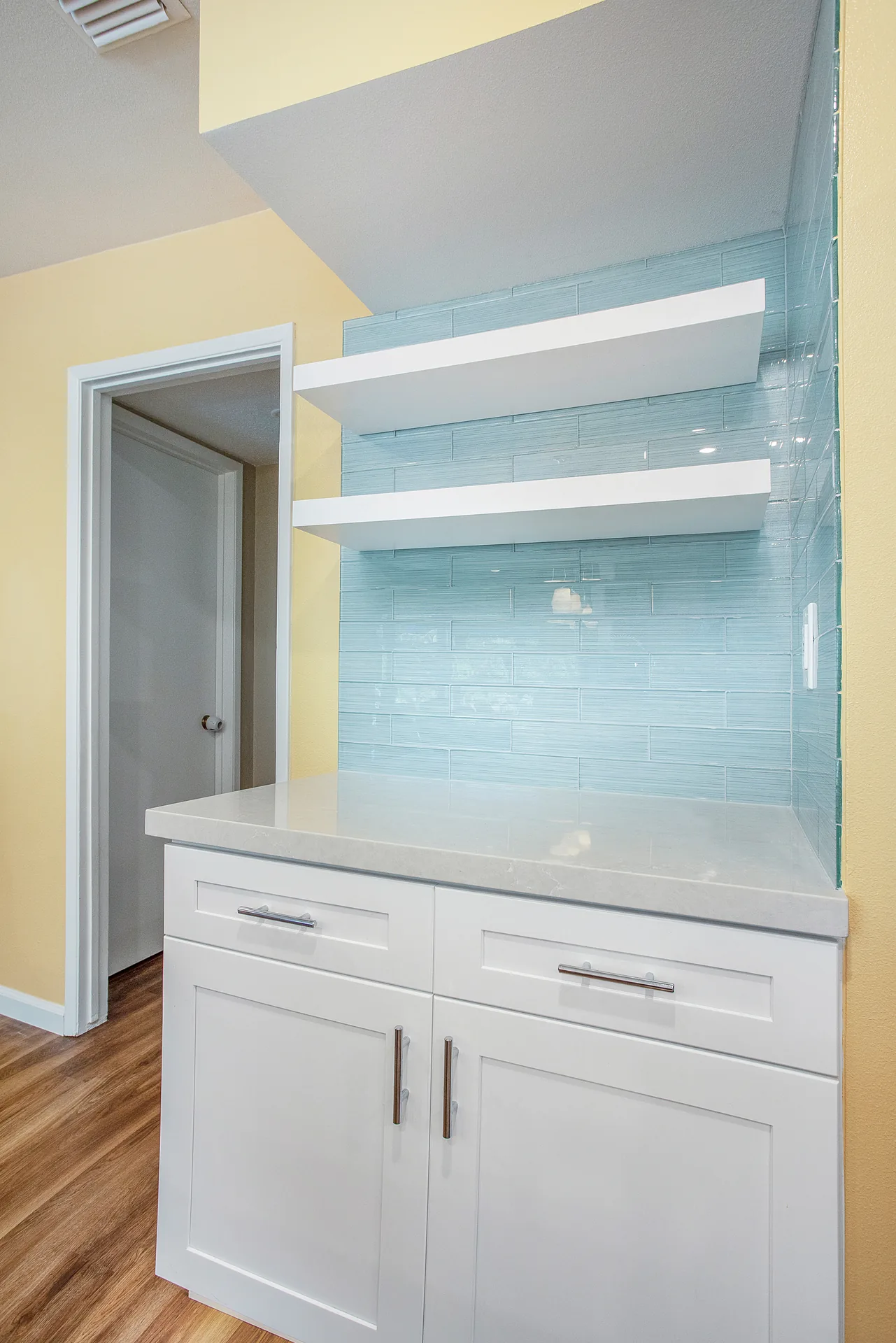 Open-concept kitchen remodel — floating shelves on glass tile, Orange, Avorino