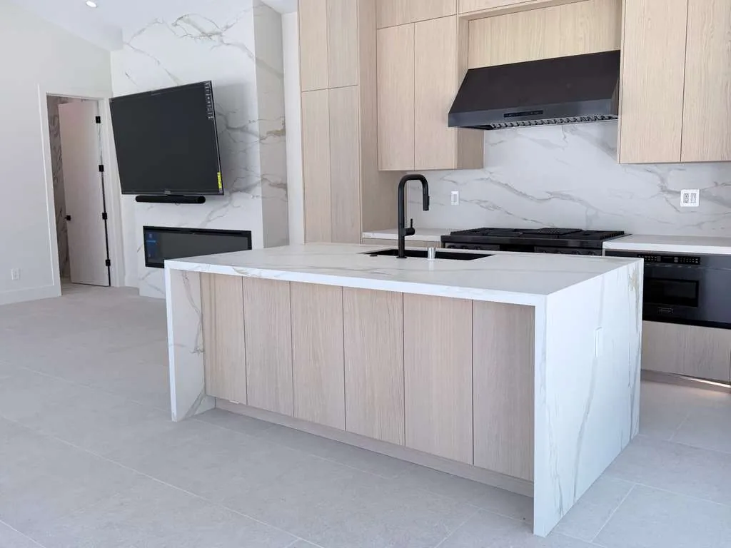 Custom pool house — kitchen island and media wall, San Juan Capistrano, Avorino