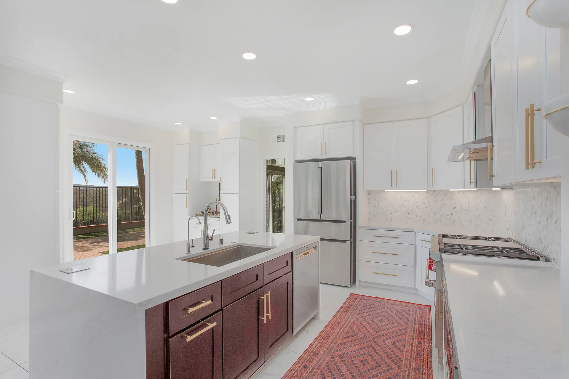 Custom home — kitchen island toward the sliders, Aliso Viejo, Avorino