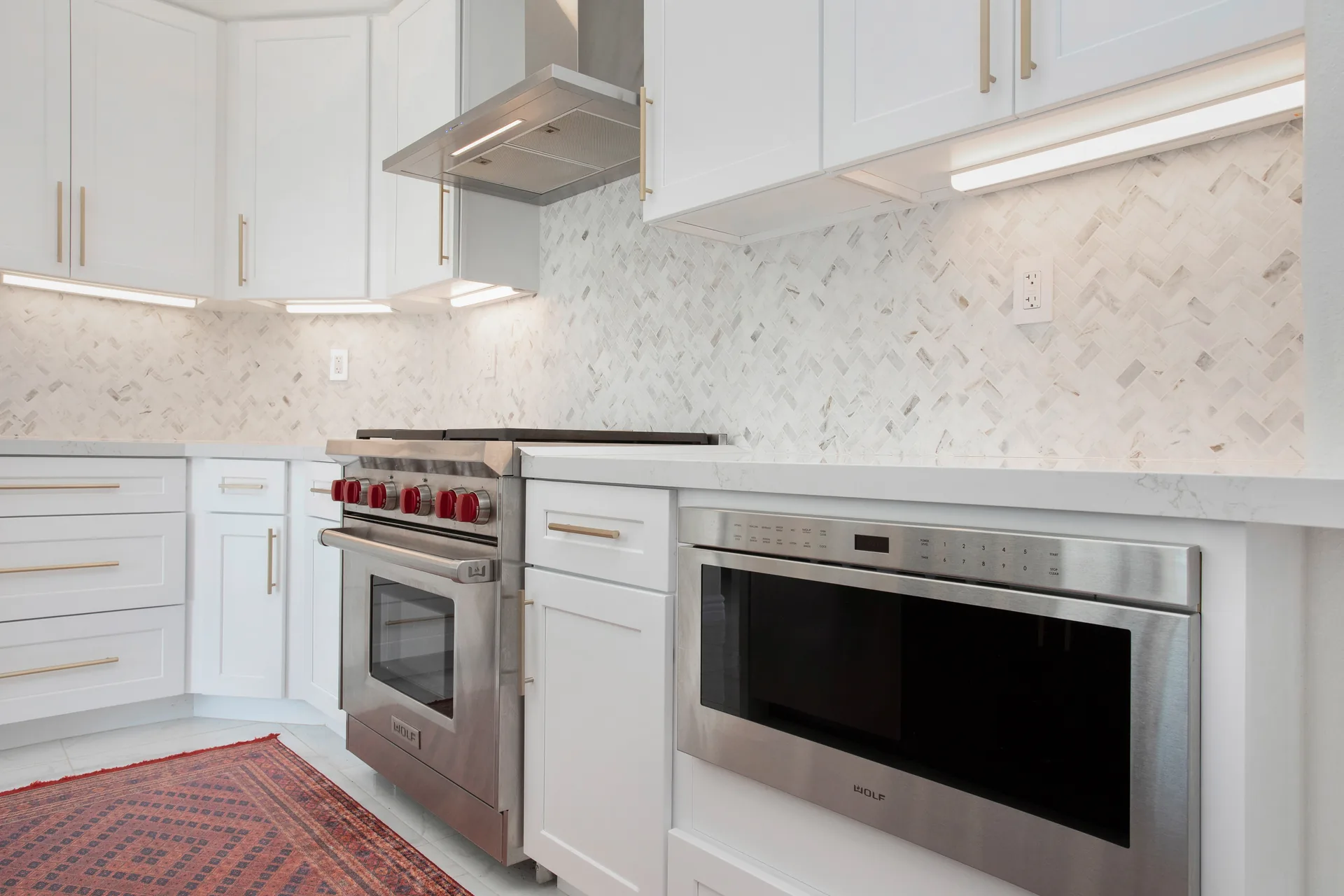 Custom home — range wall with herringbone marble backsplash, Aliso Viejo, Avorino
