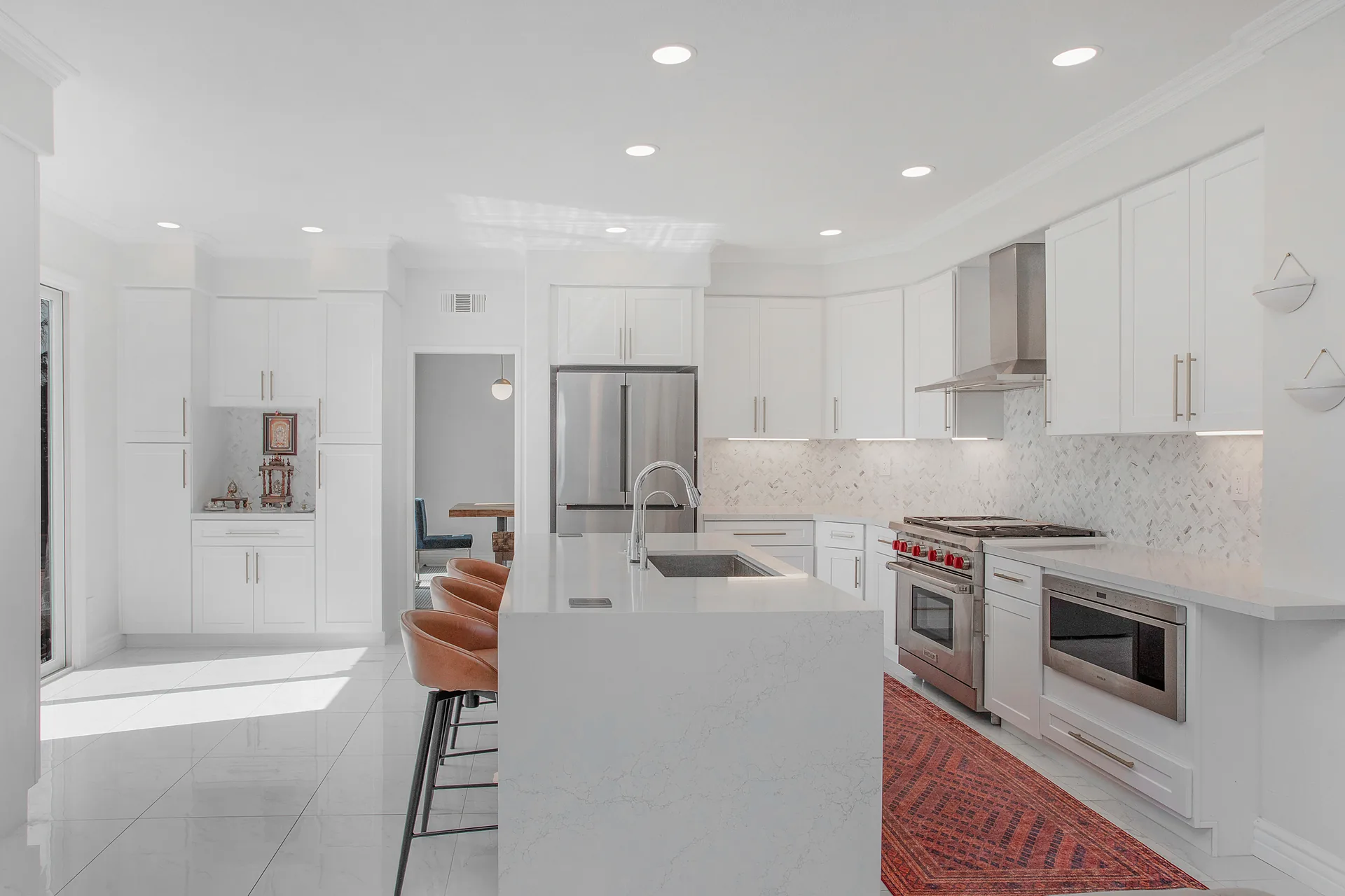 Custom home — white kitchen with island seating and marble backsplash, Aliso Viejo, Avorino
