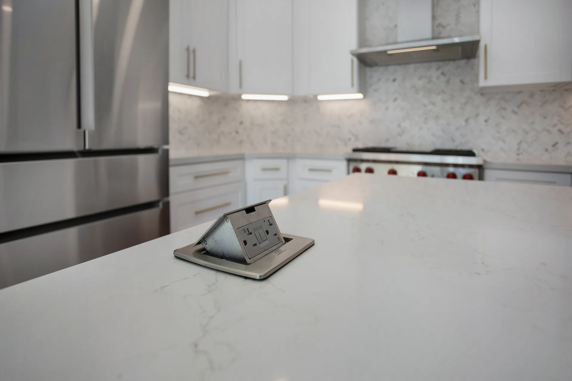 Custom home — pop-up counter outlet on the island, Aliso Viejo, Avorino