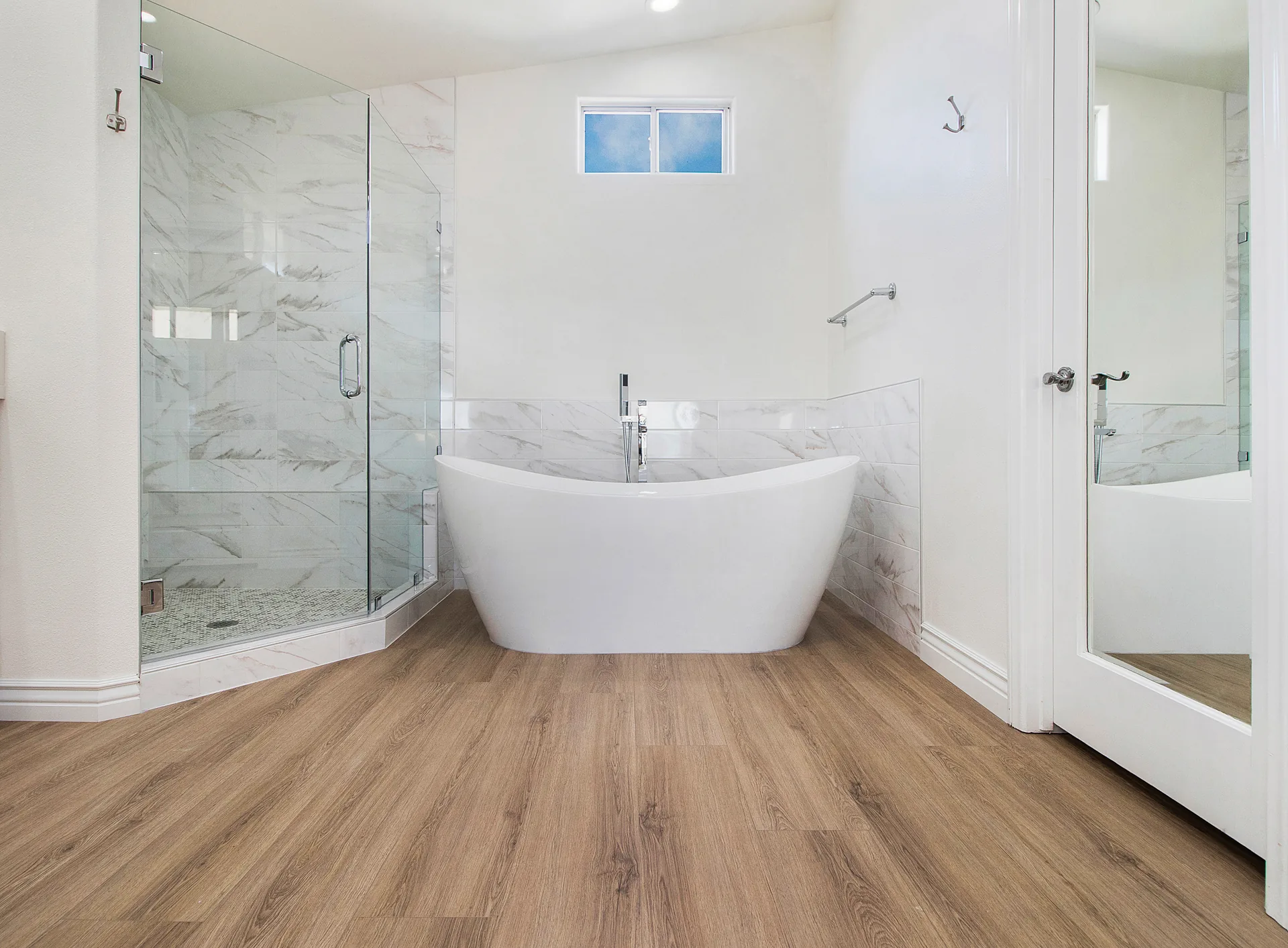 Hillside custom home — primary bath with freestanding tub and glass shower, Laguna Niguel, Avorino