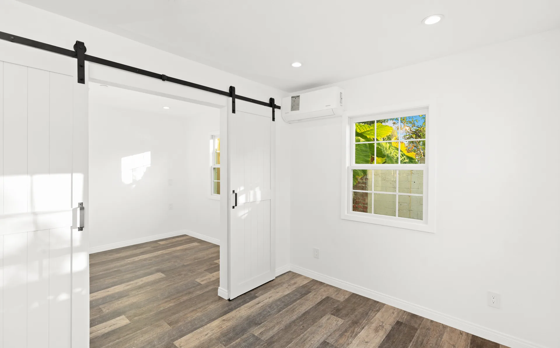 Attached ADU — bedroom with barn door, Orange, Avorino
