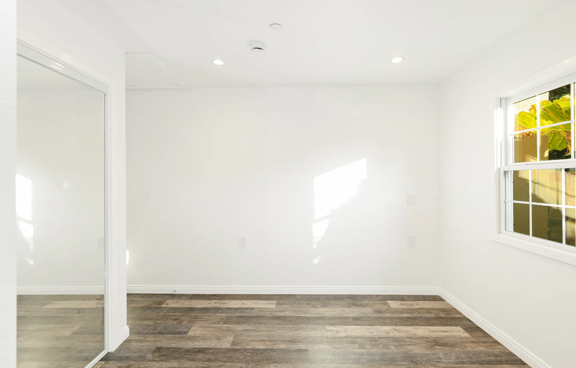 Attached ADU — living room with mirrored closet, Orange, Avorino