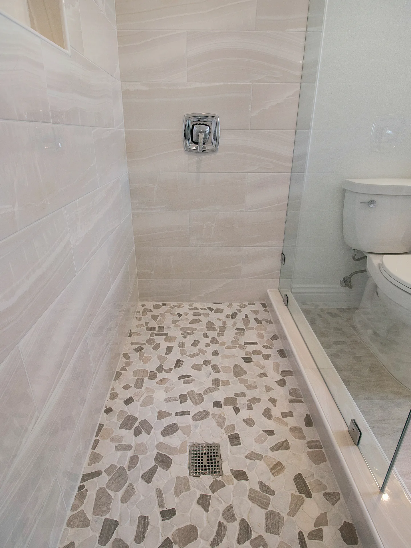 Whole-home remodel — walk-in shower with pebble floor, Laguna Niguel, Avorino